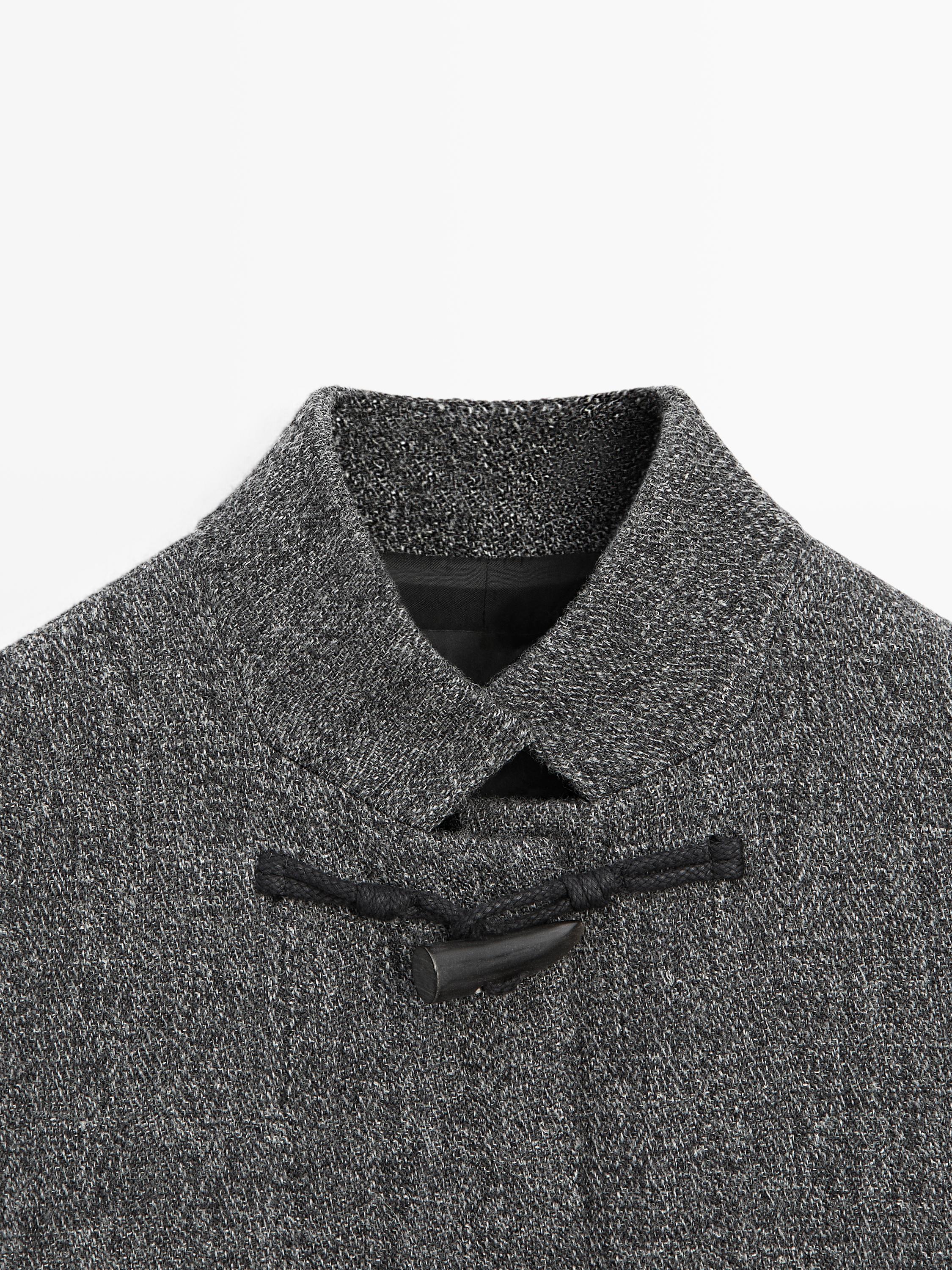 Mid-length coat with horn toggle